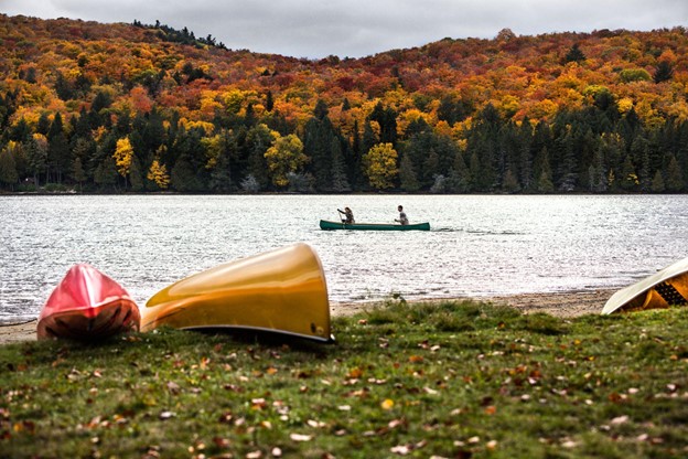 Couple enjoying a ride on a typical canoe in Algonquin Park, Ontario, Canada.