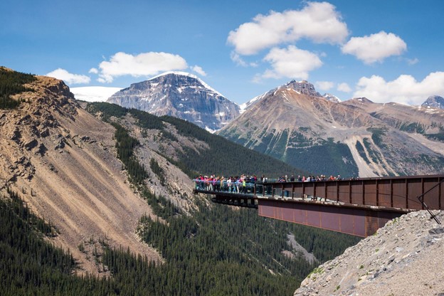 Tourists at the popular Glacier Skywalk during summer in Jasper National Park, Canadian Rockies, Alberta, Canada.