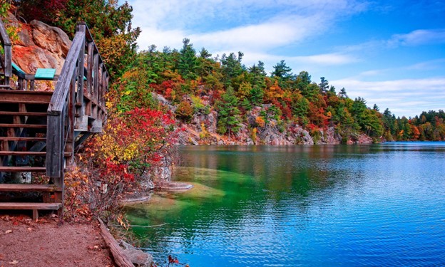 Gatineau Park lakeside lined with colourful trees