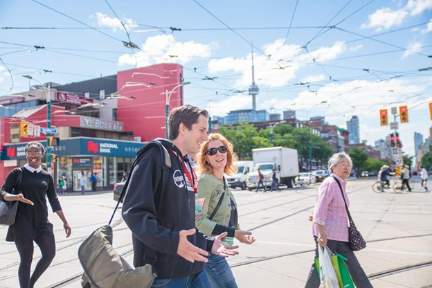 People walking near Kensington Market crossroads