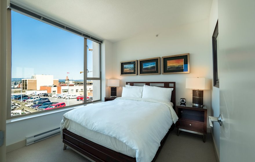 Second bedroom queen bed fully furnished apartment suite 702 Victoria