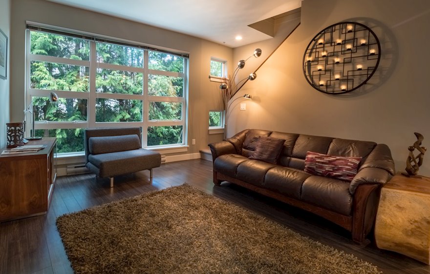 Living room large windows leather couch Victoria BC